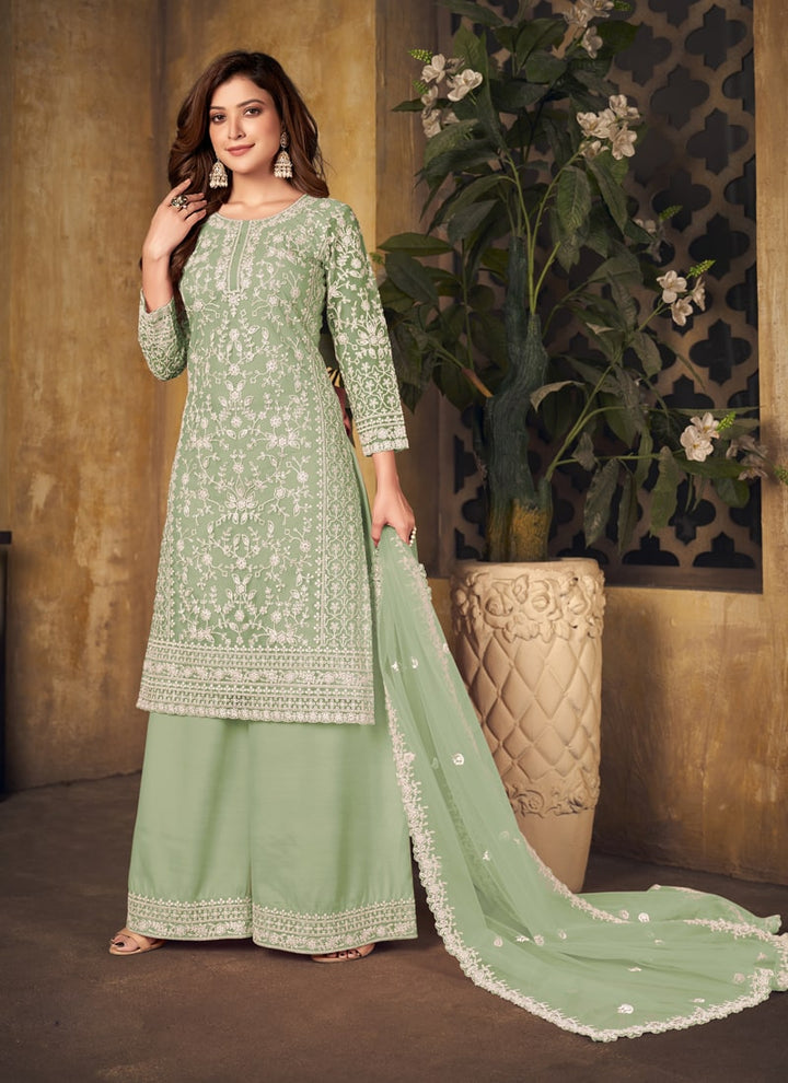 Lassya Fahion Pista Green Textured Beauty Designer Net and Santoon Palazzo Suit