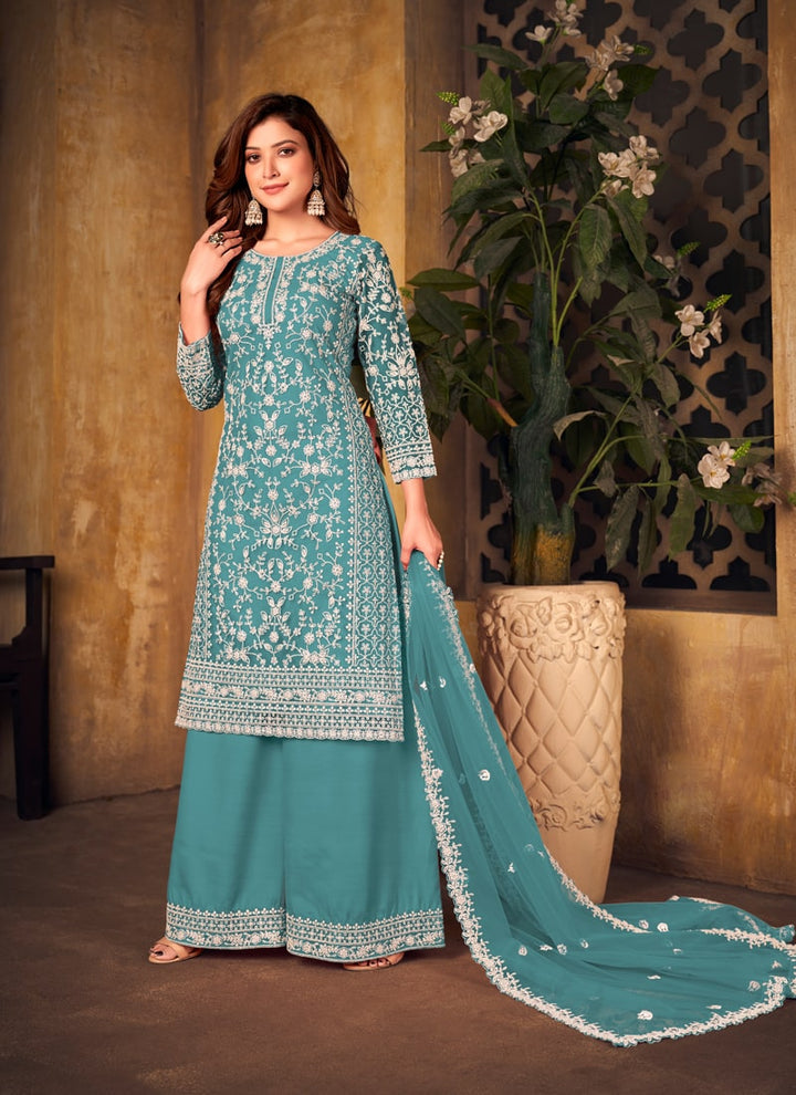 Lassya Fahion Sky Blue Textured Beauty Designer Net and Santoon Palazzo Suit