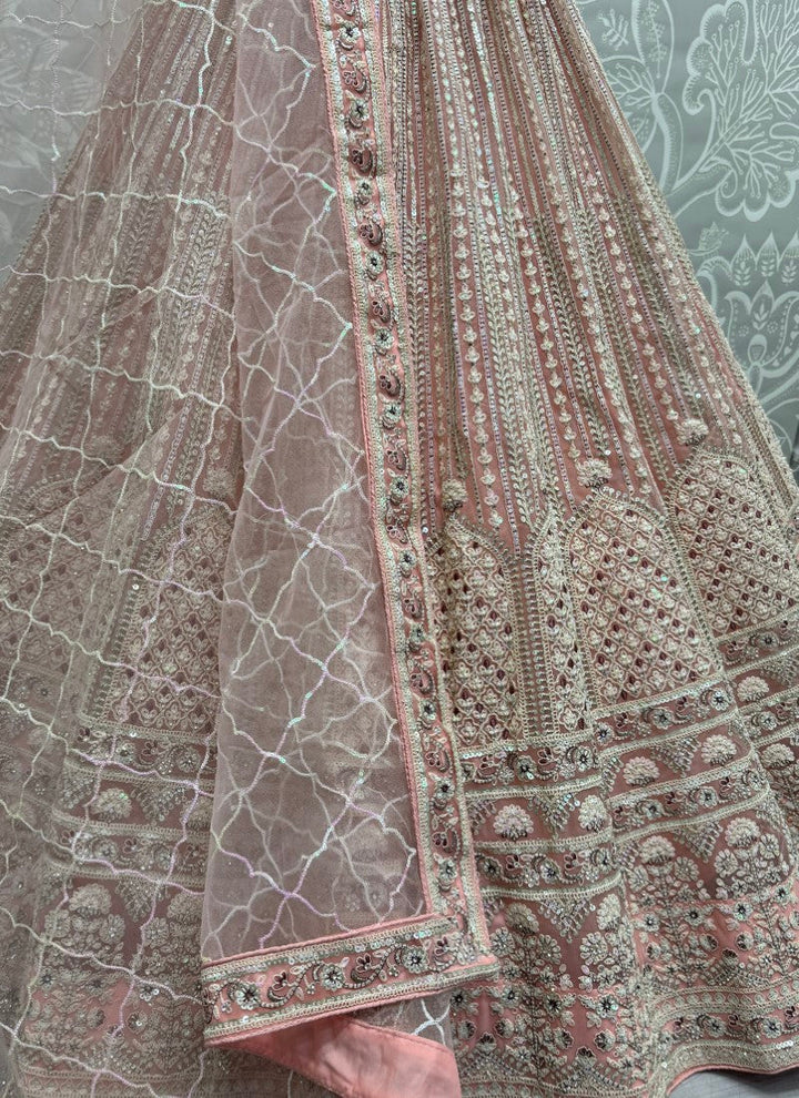 Lassya Fahion Light Pink Heavy Net Lehenga Set with Exquisite Embellishments