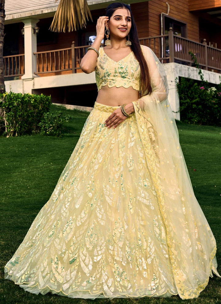 Lassya Fashion Light Yellow Shimmering Engagement Lehenga in Soft Net