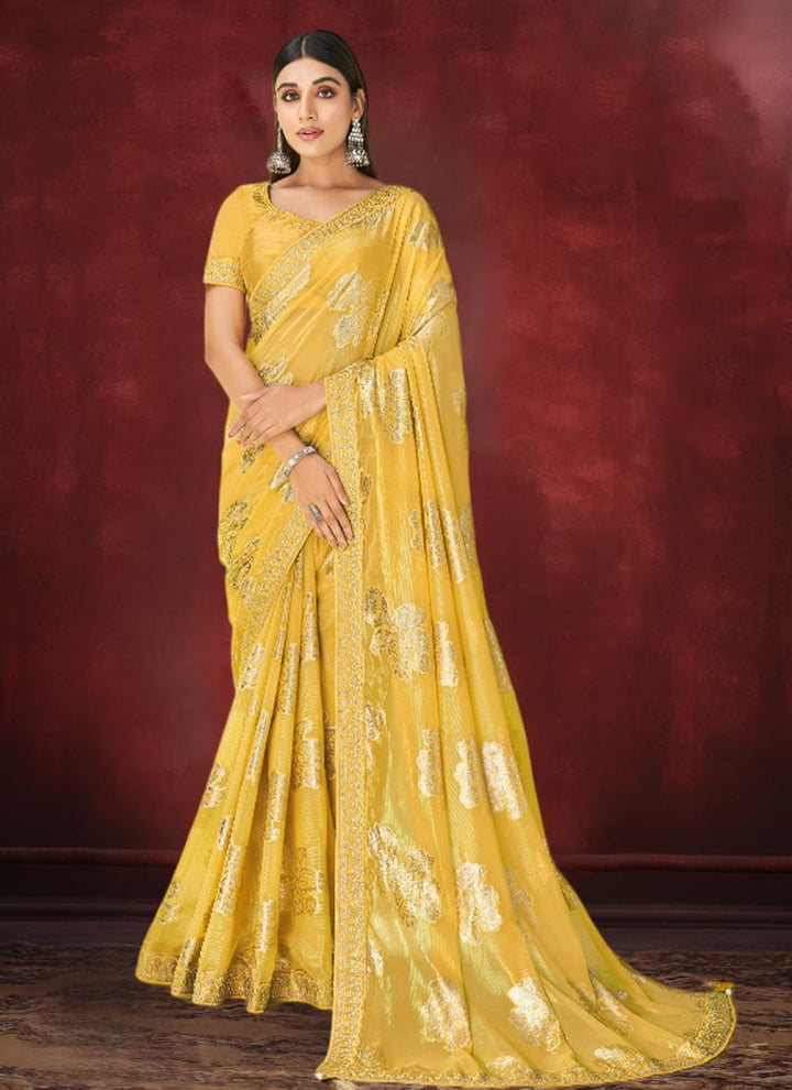 Lassya Fahion Saffron Yellow Party Wear Saree with Zari Foil Print and Stone Work