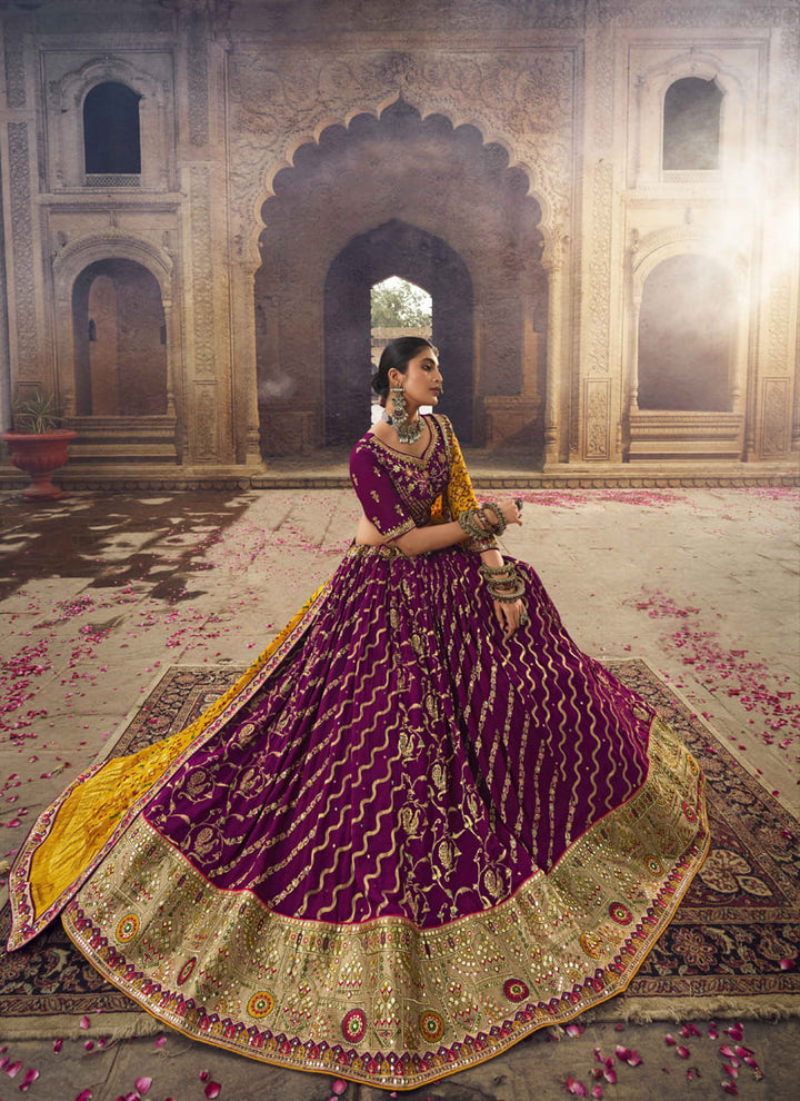 Image: Women in Purple Wine Designer Wedding Wear Lehenga Choli with Weaving Work. The lehenga choli features a rich and elegant purple wine color, accentuated with intricate weaving work. The weaving patterns add depth and texture to the ensemble, creating a captivating and luxurious look. This attire is perfect for a wedding or special occasion, emanating sophistication and glamour.